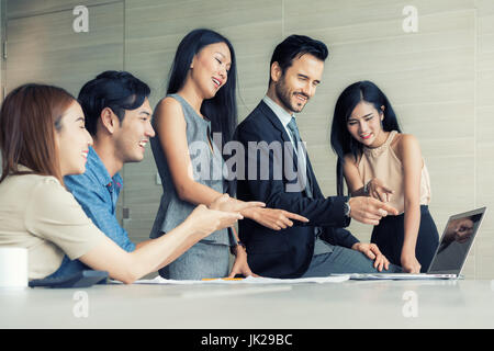 Group of multi-ethnic business partners creative project during work process. Business meeting discussion startup concept office. Stock Photo