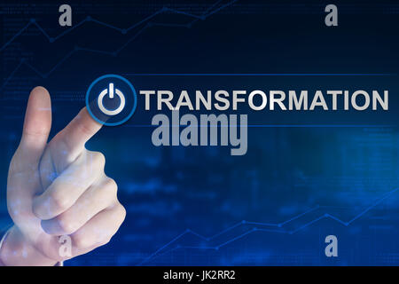 double exposure business hand clicking transformation button with blurred background Stock Photo
