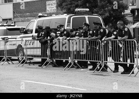 NEW YORK CITY - June 17, 2017: Police officers working during the 35th Annual Mermaid Parade in Coney Island. Stock Photo