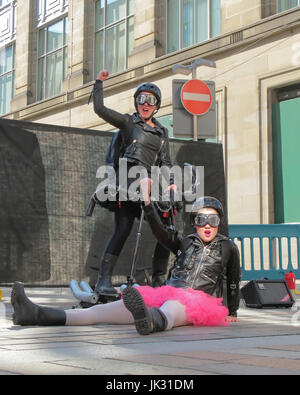 Merchant city festival scenes and performers performance girl power hells angel bikers act Stock Photo