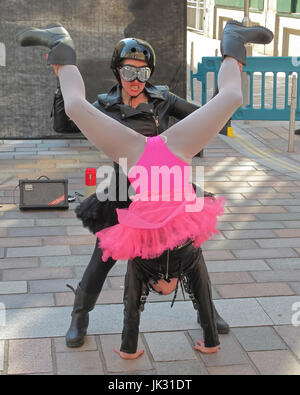 Merchant city festival scenes and performers performance girl power hells angel bikers act Stock Photo