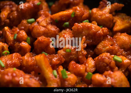 Gobi Manchurian dry - Popular street food of India made of cauliflower florets, selective focus Stock Photo