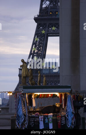 France, Paris, Eiffel Tower souvenir merchant (NR) setting up, dawn Stock Photo
