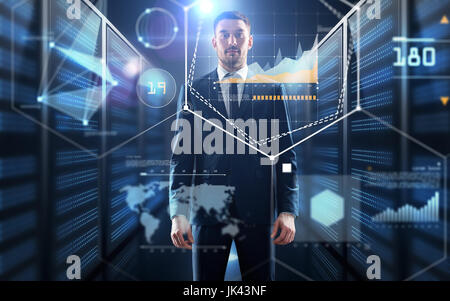 businessman with charts on virtual screen Stock Photo