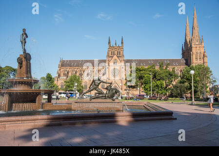 SYDNEY,NSW,AUSTRALIA-NOVEMBER 18,2016: St. Mary's Cathedral and Archibald Fountain with tourists at Hyde Park in Sydney, Australia Stock Photo