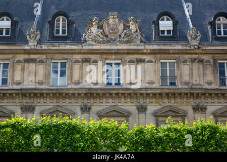 French architecture above a hedge row in the Marais district, Paris, Ile-de-France, France Stock Photo