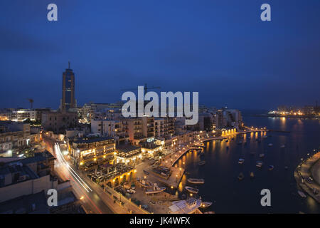 Malta, Valletta, St. Julian's, Spinola Bay and Portomaso Tower, high angle view, evening Stock Photo