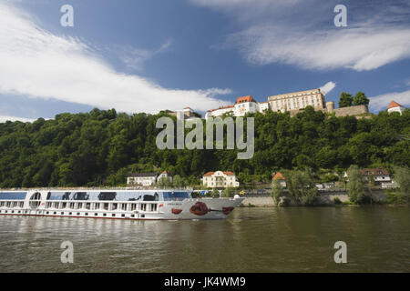 Germany, Bavaria, Passau, Veste Oberhaus fortress and Danube River cruise ship, Stock Photo