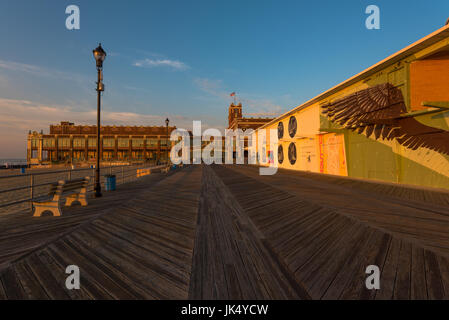 Asbury Park, NJ, USA -- July 21, 2017--Looking  east at Convention Hall on the Asbury Park boardwalk in the early morning light. Editorial Use Only Stock Photo