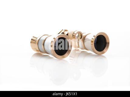 A Pair of White and Gold opera glasses on a white background with refection Stock Photo
