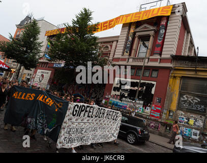 Demonstrators hold a banner reading 