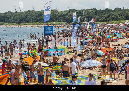 Gdansk, Poland. 22nd July, 2017. People enjoying hot and sunny weather after few weeks of cold and windy are seen on Baltic sea beach in Gdansk Brzezno, Poland on 22 July 2017 Credit: Michal Fludra/Alamy Live News Stock Photo