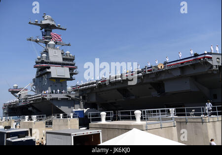 Norfolk, USA. 22nd July, 2017. Sailors stand on USS Gerald R. Ford during its commissioning ceremony at Naval Station Norfolk, Virginia, the United States, on July 22, 2017. The U.S. Navy commissioned United States Ship (USS) Gerald R. Ford, the newest and most advanced aircraft carrier, at Naval Station Norfolk, a navy base in Virginia on Saturday. Credit: Yin Bogu/Xinhua/Alamy Live News Stock Photo