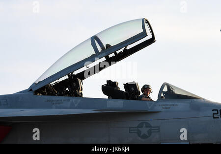 Norfolk, USA. 22nd July, 2017. A pilot is seen in an F/A-18 Fighter on USS Gerald R. Ford during its commissioning ceremony at Naval Station Norfolk, Virginia, the United States, on July 22, 2017. The U.S. Navy commissioned United States Ship (USS) Gerald R. Ford, the newest and most advanced aircraft carrier, at Naval Station Norfolk, a navy base in Virginia on Saturday. Credit: Yin Bogu/Xinhua/Alamy Live News Stock Photo