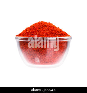 Powdered pimienta roja red pepper in saucepan, macro shot. Stock Photo