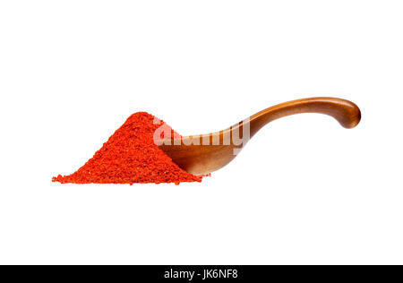 Powdered pimienta roja red pepper in the wooden spoon. Stock Photo
