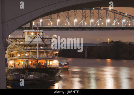 USA, Tennessee, Chattanooga, Delta Queen riverboat and Tennessee River bridges, dusk Stock Photo