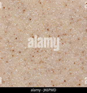 Texture new wall of small light beige artificial stone. Stock Photo