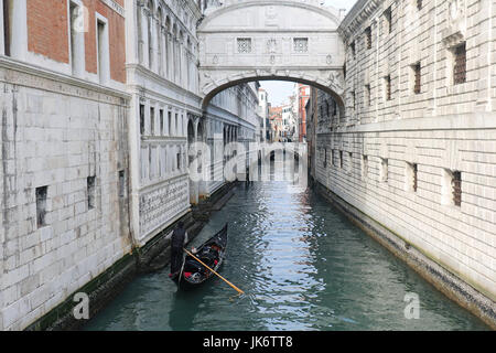 Ancient Bridge of Sighs located in Venice with gondola floating beneath Stock Photo