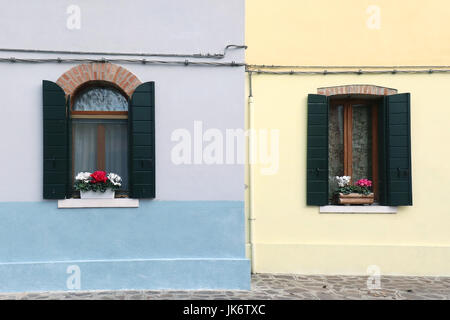 Open retro windows on colorful facades houses Stock Photo