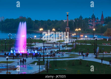 Russia, Yaroslavl Oblast, Golden Ring, Yaroslavl, Volga Riverfront, The Strelka, elevated view, fountains, evening Stock Photo