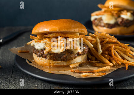 Homemade Poutine Hamburger with Fries Gravy and Cheese Curds Stock Photo