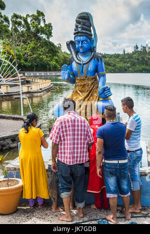 Grand Bassin, Mauritius - December 26, 2017: Group of people praying at Grand Bassin temple on December 29, 2014 in Mauritius. It is considered the mo Stock Photo