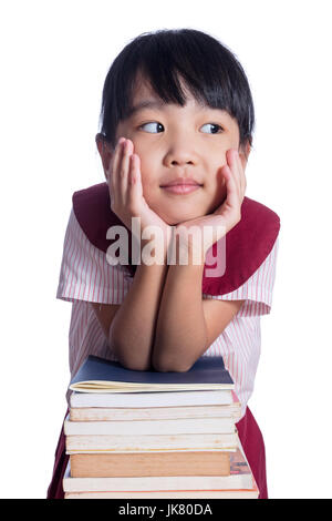 Little girl with piles of books Stock Photo - Alamy