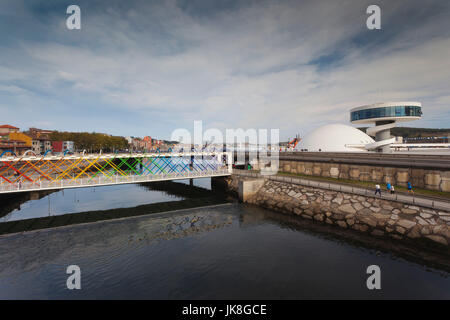 Spain, Asturias Region, Asturias Province, Aviles, Centro Niemeyer, arts center designed by Brazilian architect Oscar Niemeyer in formerly polluted industrial city, built 2011, connecting bridge Stock Photo