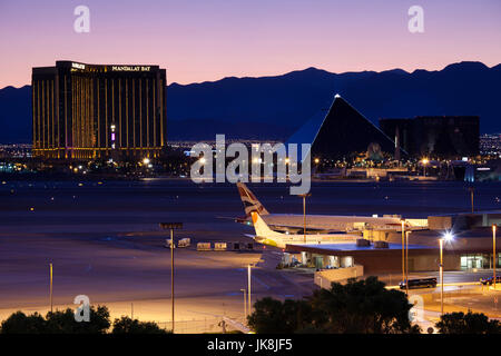 USA, Nevada, Las Vegas, view of The Strip, Las Vegas Boulevard and Mandalay Bay and Luxor  hotels from McCarran International Airport, dusk Stock Photo