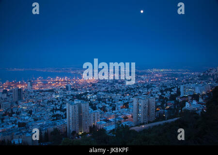 Israel, North Coast, Haifa, elevated view of downtown and Haifa Port from Carmel Center, evening Stock Photo