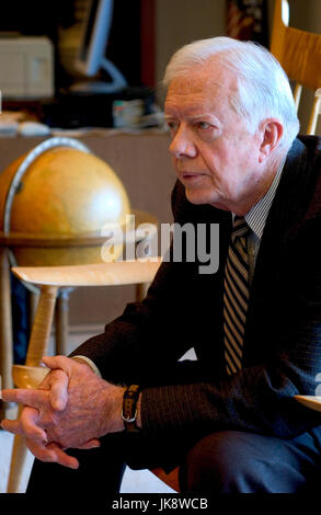 Former US President Jimmy Carter in an animated conversation in his office at The Carter Center in Atlanta, Georgia. James Earl 'Jimmy' Carter Jr. is an American politician who served as the 39th President of the United States from 1977 to 1981. He previously was the 76th governor of Georgia from 1971 to 1975, after two terms in the Georgia State Senate from 1963 to 1967. Stock Photo