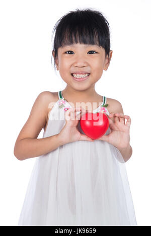 Asian Little Chinese Girl Holding Red Heart in isolated White Background Stock Photo