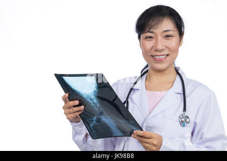Asian female doctor looking at x-ray image in isolated White Background Stock Photo