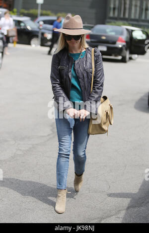 BRENTWOOD, CA - APRIL 18: Reese Witherspoon  seen after having lunch with husband Jim Toth at Taberna Restaurant in Brentwood, California on April 18, 2014. Credit: John Misa/MediaPunch