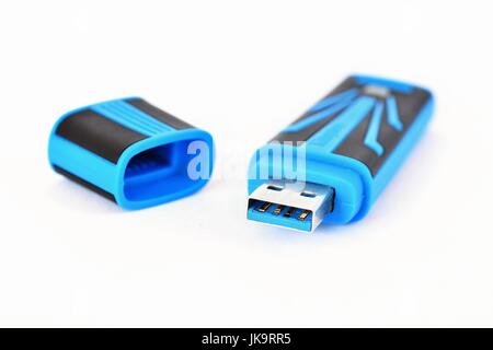 Portable flash drive isolated on a clean white background. Stock Photo