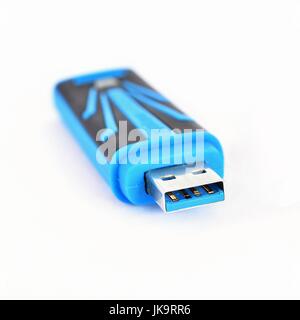 Portable flash drive isolated on a clean white background. Stock Photo