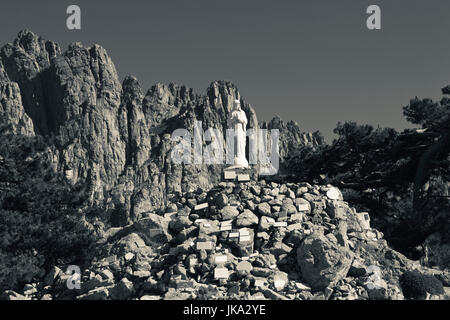 France, Corsica, Corse-du-Sud Department, La Alta Rocca Region, Col de Bavella pass, Aiguilles de Bavella peaks, statue of the Notre Dame des Neiges, Our Lady of the Snows Stock Photo