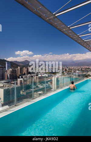 Chile, Santiago, elevated city view towards the Gran Torre Santiago tower from high rise building swimming pool Stock Photo