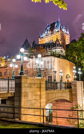 Quebec City, Canada - May 30, 2017: View of Porte Prescott bridge and Chateau Frontenac by old town street called Cote de la Montagne with stone build Stock Photo