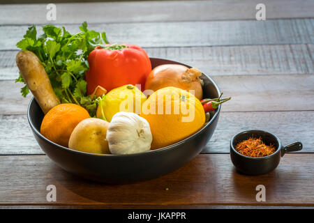 Fresh vegetables in a tray, Courgettes, onion, orange, lemon, tomato, potato Stock Photo