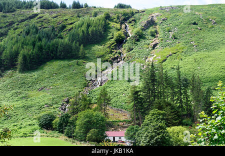 Carrawaystick Waterfall above a farm in Glenmalure, Wicklow Mountains, County Wicklow, Ireland Stock Photo