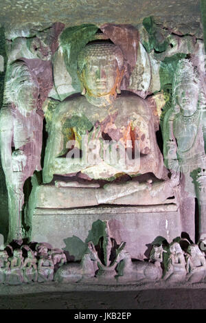 Statue of Buddha inside one of many ancient rock carved Buddhist cave temples at Ajanta Caves near Aurangabad, India. 5th-6th Century AD.