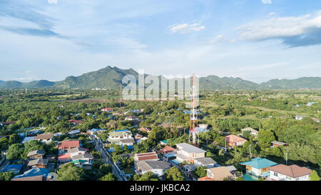 aerial view of tower mobile phone in village, communication technology Stock Photo