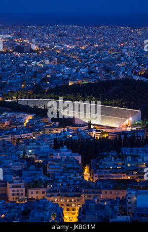 Greece, Central Greece Region, Athens, Lycabettus Hill, elevated city view with the Panathenaic Stadium, home of the first modern Olympic Games in 1896, dusk Stock Photo