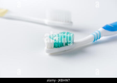 Used toothbrush and new toothbrush on white background, healthcare concept Stock Photo
