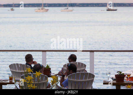 USA, Massachusetts, Cape Cod, Provincetown, The West End, Patrons on the bar deck, sunset Stock Photo