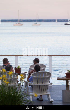 USA, Massachusetts, Cape Cod, Provincetown, The West End, Patrons on the bar deck, sunset Stock Photo