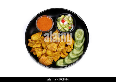 Charcoal boiled pork satay, homemade, served with cucumber chili sauce as Ar Jad in Thai and nut sauce are popular Asia cuisine. Stock Photo