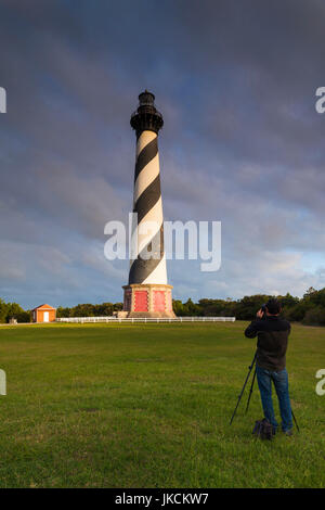 USA, North Carolina, Cape Hatteras National Saeshore, Buxton, Cape Hatteras Lighthouse, b. 1870, tallest brick structure in the US, with photographer, NR Stock Photo